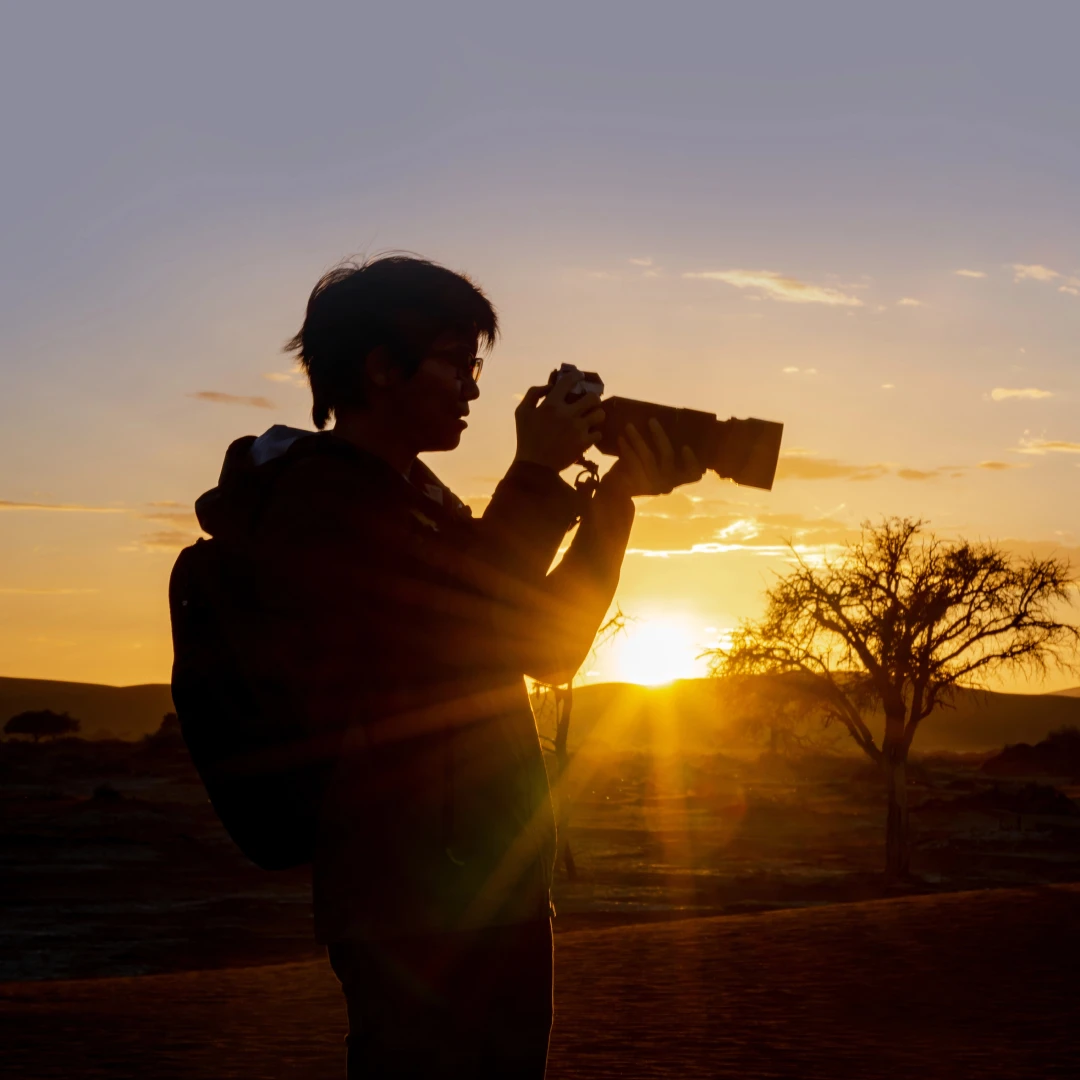 Photographer silhouette at sunrise.