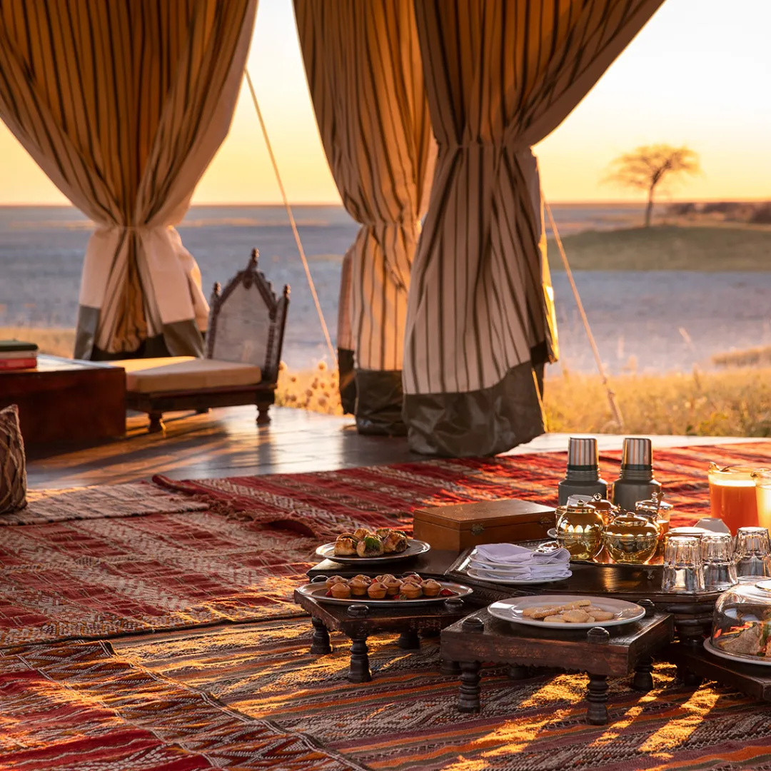 Safari tent tea service at sunset.