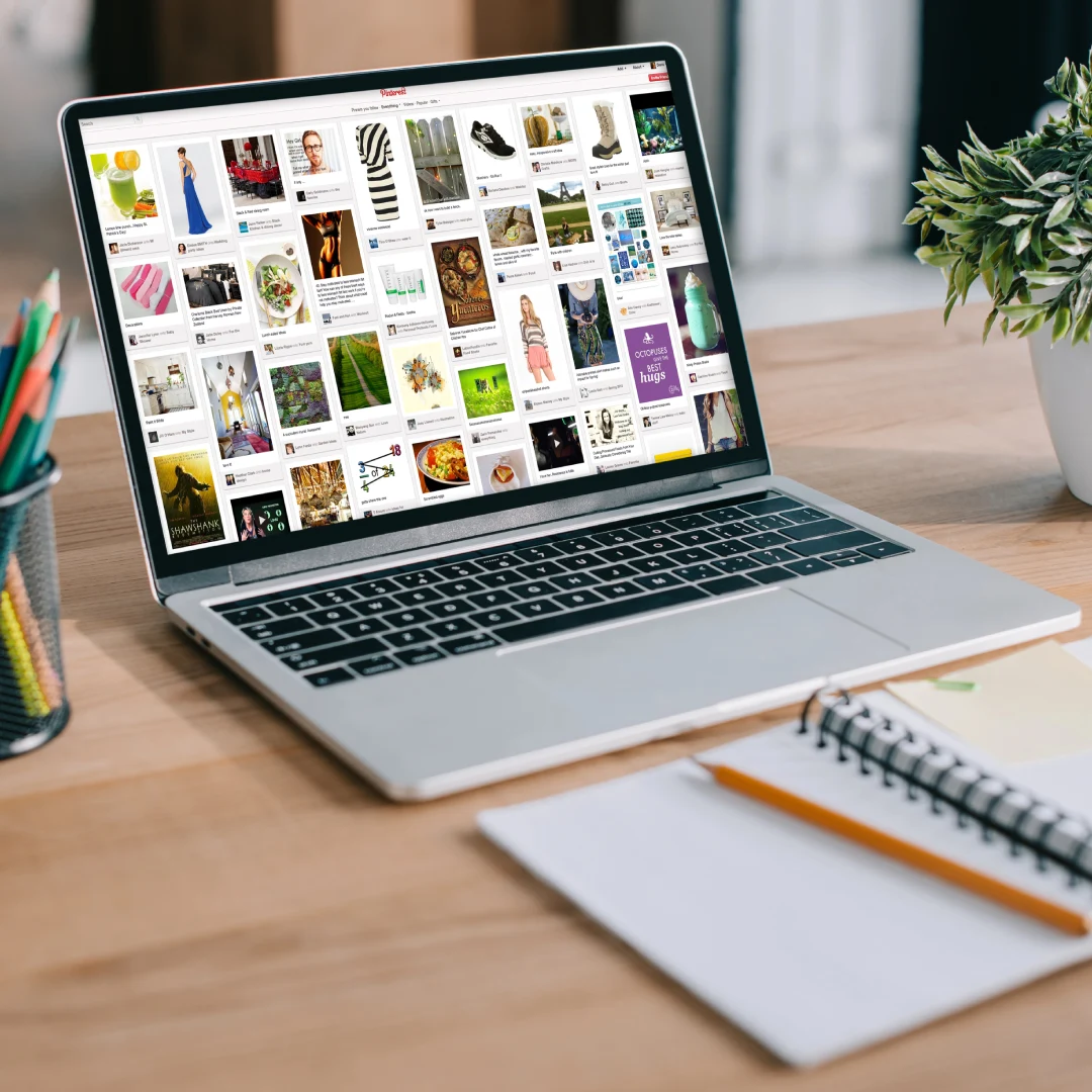 Laptop showing Pinterest feed.