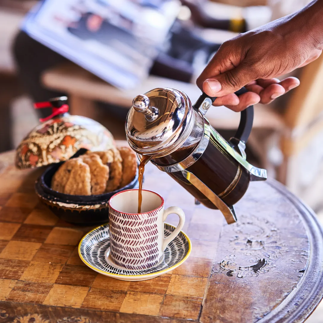 Pouring coffee from French press.