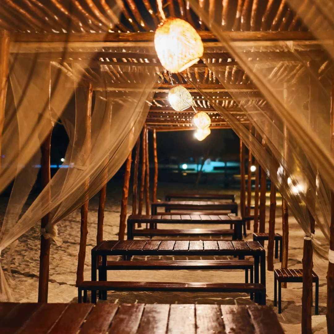 Beach canopy seating at night.